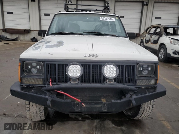 1996 Jeep Cherokee Sport with VIN 1J4FJ68S9TL284984, listed as a Copart auction lot 86307644 with 136,142 mi miles and Salvage Title. Bid and sale history available at carsss.com. Image 5.