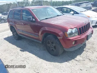 2007 Jeep Grand Cherokee Laredo with VIN 1J8GR48K57C618529, listed as a IAAI auction lot 42139566 with 174,559 mi miles. Bid and sale history available at carsss.com. Image 1.