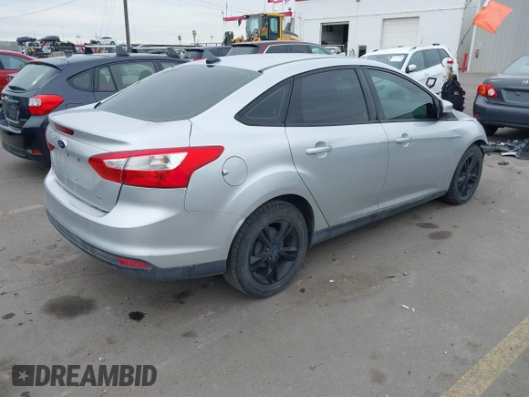 2013 Ford Focus SE with VIN 1FADP3F20DL361469, listed as a IAAI auction lot 41457037 with 127,852 mi miles. Bid and sale history available at carsss.com. Image 4.