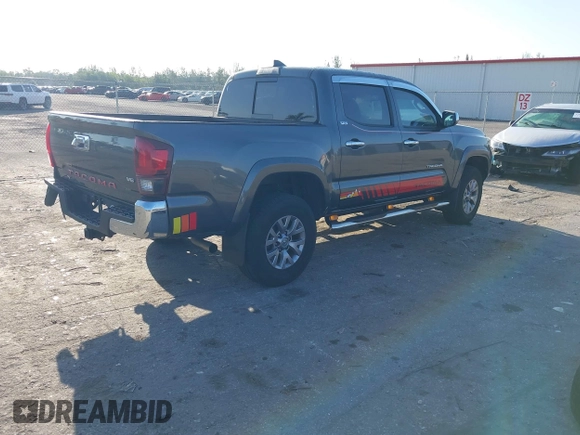 2018 Toyota Tacoma SR5 with VIN 3TMAZ5CN4JM069965, listed as a IAAI auction lot 41798238 with 124,619 mi miles and . Bid and sale history available at DreamBid. Image 4.