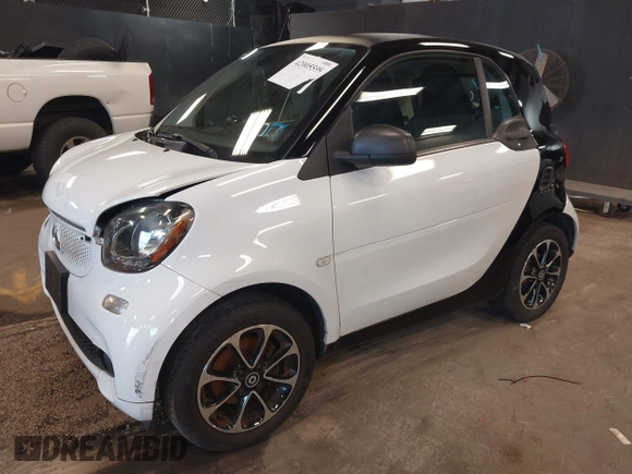 2016 Smart fortwo Passion z VIN WMEFJ5DA9GK061774, wystawiony jako IAAI lot #42005599 z przebiegiem 44 323 mil mil oraz . Historia ofert i sprzedaży dostępna na DreamBid. Obrazek 2.