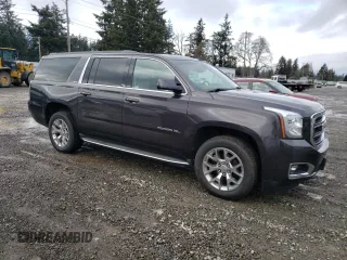 2015 GMC Yukon XL SLT with VIN 1GKS2HKC7FR282543, listed as a Copart auction lot 45602075 with 153,913 mi miles and Clean Title. Bid and sale history available at carsss.com. Image 4.