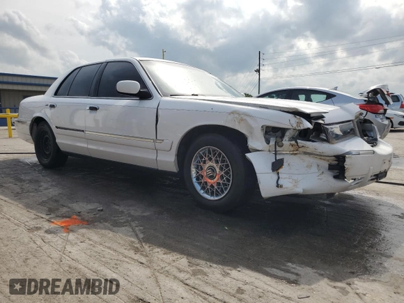 2000 Mercury Grand Marquis GS z VIN 2MEFM74WXYX699560, wystawiony jako Copart lot #57721925 z przebiegiem 246 297 mil mil oraz Szkoda całkowita • Salvage title. Historia ofert i sprzedaży dostępna na DreamBid. Obrazek 4.