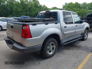 2005 Ford Explorer Sport Trac XLS z VIN 1FMZU77K75UB52008, wystawiony jako IAAI lot #42103222 z przebiegiem 196 605 mil mil oraz . Historia ofert i sprzedaży dostępna na DreamBid. Obrazek 4.