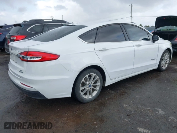 2019 Ford Fusion Hybrid SE with VIN 3FA6P0LU9KR206740, listed as a IAAI auction lot 41933661 with 143,111 mi miles. Bid and sale history available at carsss.com. Image 4.