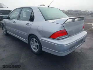 2002 Mitsubishi Lancer OZ-Rally with VIN JA3AJ86E92U038601, listed as a IAAI auction lot 41025991 with 162,450 mi miles. Bid and sale history available at carsss.com. Image 3.
