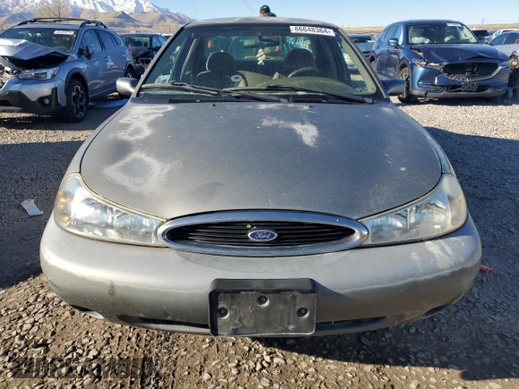 1998 Ford Contour z VIN 1FAFP66Z5WK232756, wystawiony jako Copart lot #86648364 z przebiegiem 118 176 mil mil oraz Tytuł czysty. Historia ofert i sprzedaży dostępna na DreamBid. Obrazek 5.