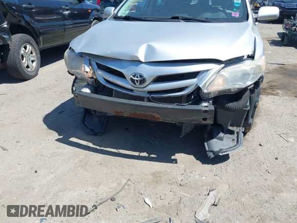 2012 Toyota Corolla L with VIN 2T1BU4EEXCC818354, listed as a IAAI auction lot 42129695 with 216,307 mi miles. Bid and sale history available at carsss.com. Image 6.