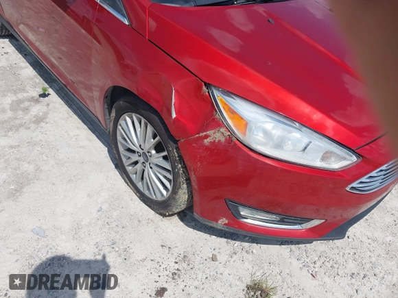 2018 Ford Focus Titanium z VIN 1FADP3J23JL295888, wystawiony jako IAAI lot #42524088 z przebiegiem 108 812 mil mil oraz . Historia ofert i sprzedaży dostępna na DreamBid. Obrazek 6.