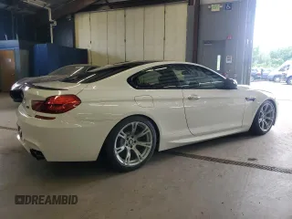 2014 BMW M6 z VIN WBSLX9C58ED160480, wystawiony jako Copart lot #64464985 z przebiegiem 58 514 mil mil oraz Czysty tytuł • Clean title. Historia ofert i sprzedaży dostępna na DreamBid. Obrazek 3.