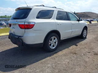 2012 Dodge Durango SXT z VIN 1C4RDJAG0CC294998, wystawiony jako IAAI lot #42230396 z przebiegiem 62 963 mil mil oraz . Historia ofert i sprzedaży dostępna na DreamBid. Obrazek 4.
