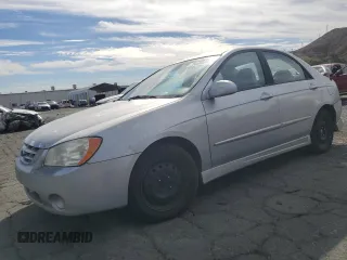 2006 Kia Spectra EX with VIN KNAFE122765228554, listed as a Copart auction lot 78458004 with 154,085 mi miles and Clean Title. Bid and sale history available at carsss.com. Image 1.