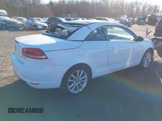 2015 Volkswagen Eos Komfort with VIN WVWBW8AH0FV001011, listed as a IAAI auction lot 41297299 with 81,444 mi miles and . Bid and sale history available at DreamBid. Image 4.