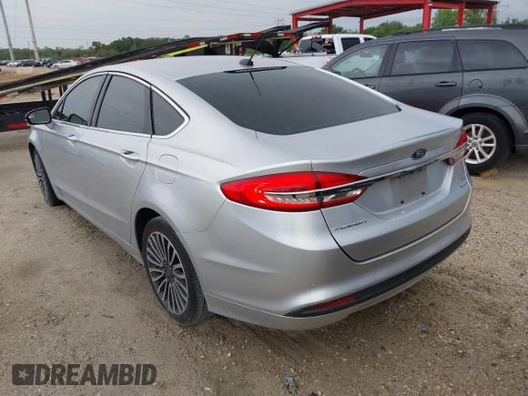 2017 Ford Fusion SE z VIN 3FA6P0HD5HR166433, wystawiony jako IAAI lot #42394998 z przebiegiem 121 333 mil mil oraz . Historia ofert i sprzedaży dostępna na DreamBid. Obrazek 3.