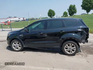 2018 Ford Escape S with VIN 1FMCU0F78JUB60610, listed as a IAAI auction lot 42447952 with 112,184 mi miles and . Bid and sale history available at DreamBid. Image 14.