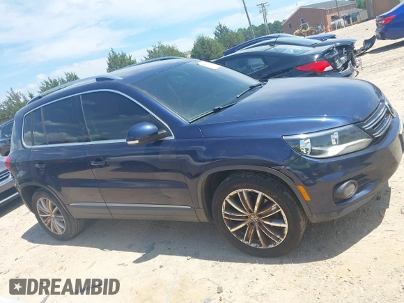 2012 Volkswagen Tiguan SE with VIN WVGAV7AX7CW534703, listed as a IAAI auction lot 42463358 with 119,699 mi miles and . Bid and sale history available at DreamBid. Image 13.