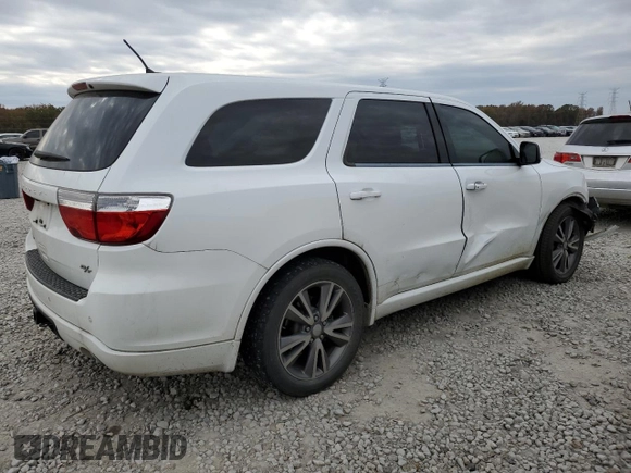 2013 Dodge Durango R/T with VIN 1C4SDHCT0DC648668, listed as a Copart auction lot 83211194 with 149,649 mi miles and Salvage title. Bid and sale history available at DreamBid. Image 3.