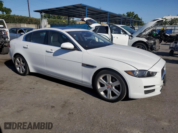 2017 Jaguar XE with VIN SAJAE4BNXHA968653, listed as a Copart auction lot 57039744 with 148,481 mi miles and Salvage Title. Bid and sale history available at DreamBid. Image 4.