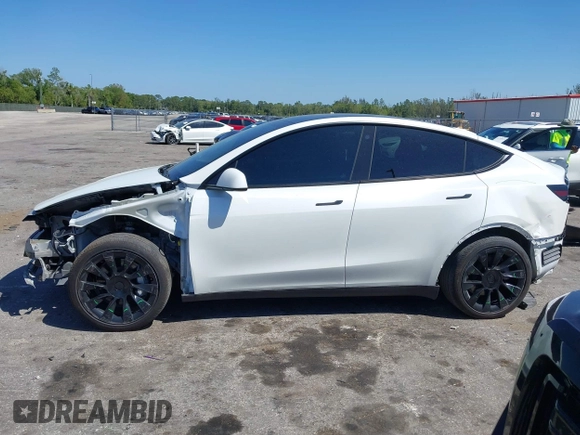 2022 Tesla Model Y Long Range with VIN 7SAYGAEE8NF431786, listed as a IAAI auction lot 41750353 with 67,846 mi miles and . Bid and sale history available at carsss.com. Image 15.