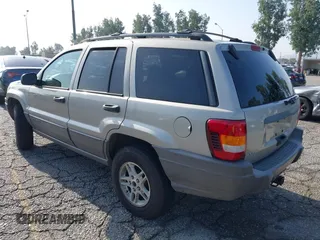 2004 Jeep Grand Cherokee Laredo with VIN 1J4GX48N24C334983, listed as a IAAI auction lot 42522088 with 169,793 mi miles and . Bid and sale history available at DreamBid. Image 3.