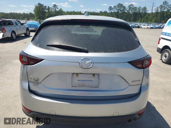 2020 Mazda CX-5 Touring z VIN JM3KFBCM2L1824072, wystawiony jako Copart lot #54825295 z przebiegiem 99 420 mil mil oraz Szkoda całkowita • Salvage title. Historia ofert i sprzedaży dostępna na DreamBid. Obrazek 6.