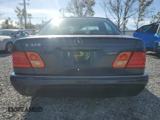 1998 Mercedes-Benz E-Class with VIN WDBJF65F3WA642006, listed as a Copart auction lot 87309994 with 129,837 mi miles and Salvage Title. Bid and sale history available at carsss.com. Image 6.