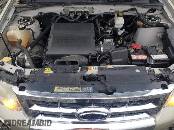 2010 Ford Escape Limited with VIN 1FMCU0EGXAKA03092, listed as a Copart auction lot 61094785 with 114,884 mi miles and Salvage title. Bid and sale history available at DreamBid. Image 12.
