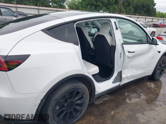 2022 Tesla Model Y Long Range z VIN 7SAYGDEE2NF420882, wystawiony jako IAAI lot #42023642 z przebiegiem 19 783 mil mil oraz . Historia ofert i sprzedaży dostępna na DreamBid. Obrazek 20.