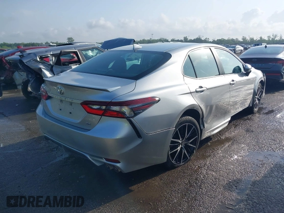 2021 Toyota Camry SE Nightshade with VIN 4T1G11AKXMU599663, listed as a IAAI auction lot 41902392 with 76,909 mi miles. Bid and sale history available at carsss.com. Image 4.