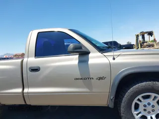 2002 Dodge Dakota with VIN 1B7FL16X72S642881, listed as a IAAI auction lot 42153560 with 220,917 mi miles and . Bid and sale history available at carsss.com. Image 13.