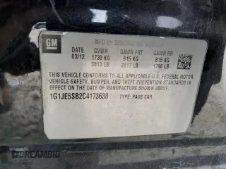 2012 Chevrolet Sonic LTZ z VIN 1G1JE5SB2C4173638, wystawiony jako Copart lot #84634474 z przebiegiem 148 247 mil mil oraz Szkoda całkowita • Salvage title. Historia ofert i sprzedaży dostępna na DreamBid. Obrazek 12.