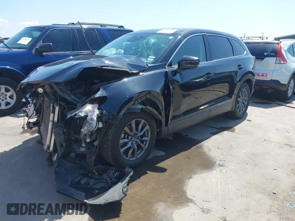 2023 Mazda CX-9 Touring with VIN JM3TCBCY2P0651679, listed as a IAAI auction lot 42002920 with 67,791 mi miles and . Bid and sale history available at DreamBid. Image 2.