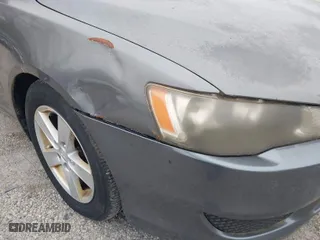 2008 Mitsubishi Lancer DE with VIN JA3AU26U48U012900, listed as a IAAI auction lot 41988059 with 216,797 mi miles. Bid and sale history available at carsss.com. Image 6.
