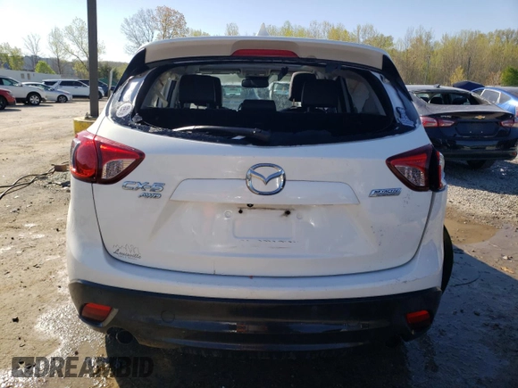 2014 Mazda CX-5 Grand Touring with VIN JM3KE4DY6E0376413, listed as a Copart auction lot 53204935 with 126,791 mi miles and Salvage Title. Bid and sale history available at DreamBid. Image 6.
