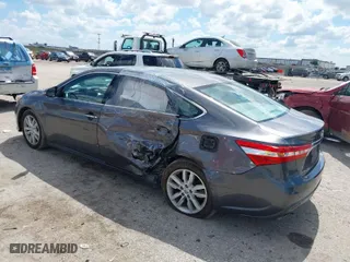 2014 Toyota Avalon Limited with VIN 4T1BK1EB3EU100754, listed as a IAAI auction lot 39446319 with 82,624 mi miles. Bid and sale history available at carsss.com. Image 3.