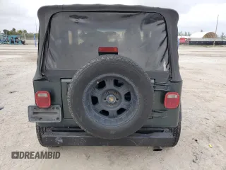 2003 Jeep Wrangler SE with VIN 1J4FA29103P313229, listed as a Copart auction lot 79337984 with 135,668 mi miles and Salvage title. Bid and sale history available at DreamBid. Image 6.
