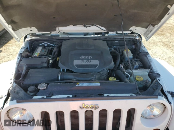 2012 Jeep Wrangler Arctic z VIN 1C4AJWBG4CL175580, wystawiony jako Copart lot #47866295 z przebiegiem 75 086 mil mil oraz Szkoda całkowita • Salvage title. Historia ofert i sprzedaży dostępna na DreamBid. Obrazek 11.