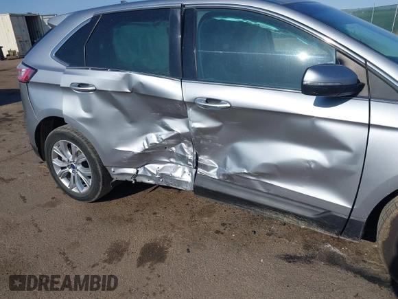 2022 Ford Edge Titanium z VIN 2FMPK4K95NBA33637, wystawiony jako IAAI lot #42074777 z przebiegiem 58 733 mil mil oraz . Historia ofert i sprzedaży dostępna na DreamBid. Obrazek 6.