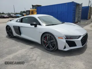 2020 Audi R8 z VIN WUAKBAFX9L7900195, wystawiony jako Copart lot #59888215 z przebiegiem 16 548 mil mil oraz Czysty tytuł • Clean title. Historia ofert i sprzedaży dostępna na DreamBid. Obrazek 4.
