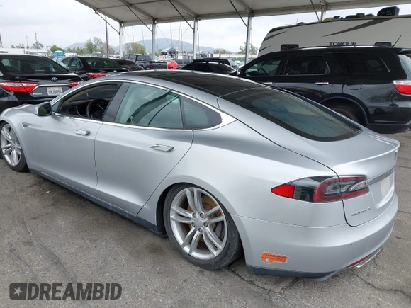 2014 Tesla Model S 60 with VIN 5YJSA1H12EFP32213, listed as a IAAI auction lot 42194085 with 56,071 mi miles and . Bid and sale history available at DreamBid. Image 3.