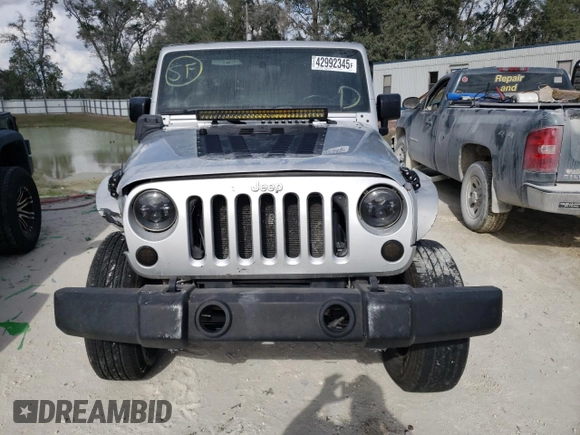 2011 Jeep Wrangler Sport with VIN 1J4GA2D15BL592081, listed as a Copart auction lot 42992345 with 139,364 mi miles and Salvage Title. Bid and sale history available at carsss.com. Image 5.
