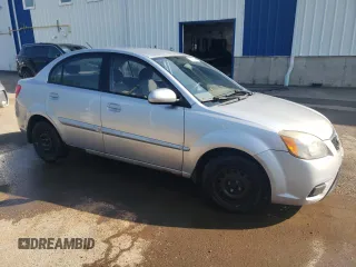2011 Kia Rio with VIN KNADH4B32B6915275, listed as a Copart auction lot 71546484 with 297,998 mi miles and Salvage Title. Bid and sale history available at DreamBid. Image 4.