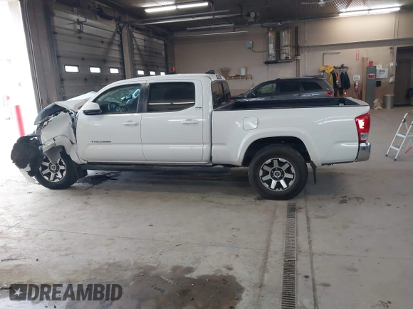 2016 Toyota Tacoma SR5 with VIN 3TMDZ5BN2GM007990, listed as a IAAI auction lot 41288736 with 76,179 mi miles. Bid and sale history available at carsss.com. Image 14.