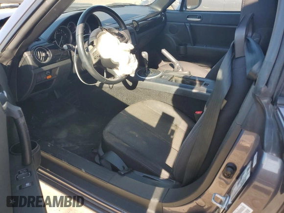 2006 Mazda MX-5 Miata Sport z VIN JM1NC25F260115830, wystawiony jako Copart lot #76844774 z przebiegiem 52 599 mil mil oraz Szkoda całkowita • Salvage title. Historia ofert i sprzedaży dostępna na DreamBid. Obrazek 8.