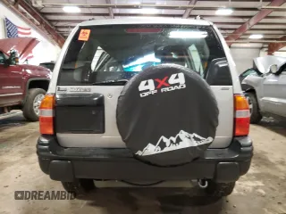 2004 Suzuki Vitara JX z VIN 2S3TD52V546100133, wystawiony jako Copart lot #72629154 z przebiegiem 186 597 mil mil oraz Tytuł czysty. Historia ofert i sprzedaży dostępna na DreamBid. Obrazek 6.
