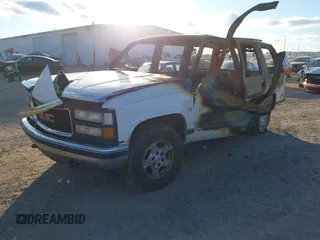 1999 GMC Yukon with VIN 1GKEK13R2XJ723955, listed as a IAAI auction lot 41242520 with 1 mi miles. Bid and sale history available at carsss.com. Image 2.