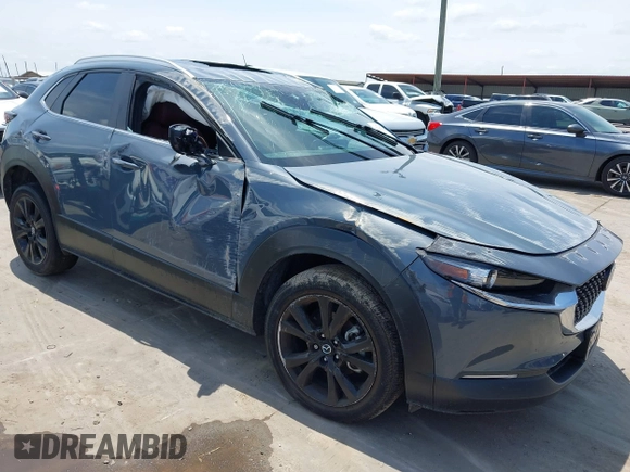 2022 Mazda CX-30 S Carbon Edition with VIN 3MVDMBCL6NM410330, listed as a IAAI auction lot 42107426 with 30,277 mi miles and . Bid and sale history available at DreamBid. Image 1.