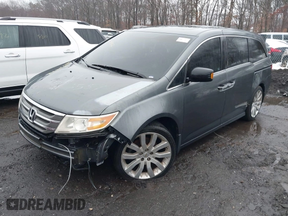 2012 Honda Odyssey Touring with VIN 5FNRL5H98CB089871, listed as a IAAI auction lot 41351447 with 999,999 mi miles. Bid and sale history available at carsss.com. Image 2.