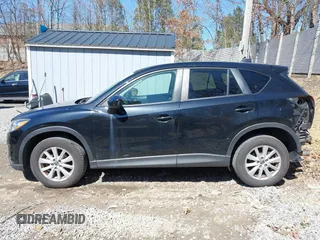 2014 Mazda CX-5 Touring with VIN JM3KE4CY8E0333029, listed as a IAAI auction lot 41857199 with 218,887 mi miles. Bid and sale history available at carsss.com. Image 14.