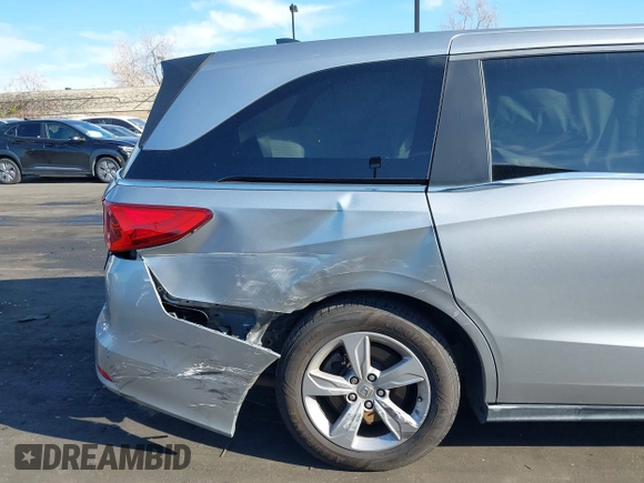 2018 Honda Odyssey EX-L with VIN 5FNRL6H71JB089289, listed as a IAAI auction lot 41813322 with 94,933 mi miles and . Bid and sale history available at DreamBid. Image 6.